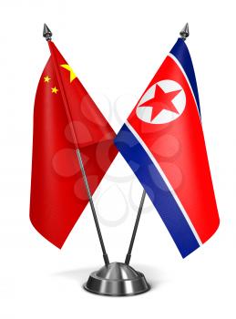 China and North Korea - Miniature Flags Isolated on White Background.