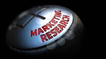 Marketing Research - Red Text on Car's Shift Knob on Black Background. Close Up View. Selective Focus.