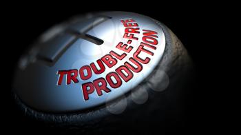 Trouble-Free Production - Red Text on Car's Shift Knob on Black Background. Close Up View. Selective Focus.
