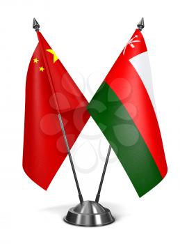China and Oman - Miniature Flags Isolated on White Background.