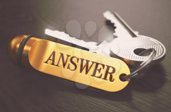 Answer- Bunch of Keys with Text on Golden Keychain. Black Wooden Background. Closeup View with Selective Focus. 3D Illustration. Toned Image.