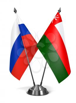 Russia and Oman - Miniature Flags Isolated on White Background.
