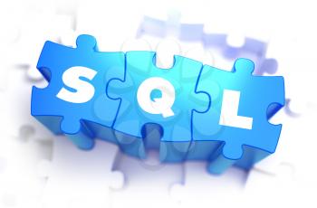 SQL - Structured Query Language - White Word on Blue Puzzles on White Background. 3D Render. 