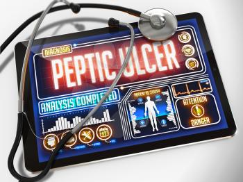 Peptic Ulcer - Diagnosis on the Display of Medical Tablet and a Black Stethoscope on White Background.