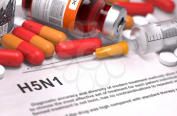H5N1 - Printed Diagnosis with Blurred Text. On Background of Medicaments Composition - Red Pills, Injections and Syringe.