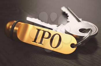 IPO - Initial Public Offering - Concept. Keys with Golden Keyring on Black Wooden Table. Closeup View, Selective Focus, 3D Render. Toned Image.