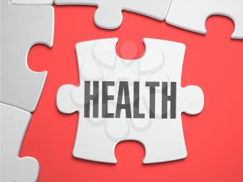 Health - Text on Puzzle on the Place of Missing Pieces. Scarlett Background. Close-up. 3d Illustration.
