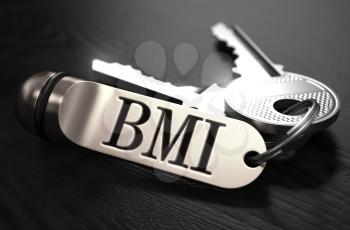 BMI - Body Mass Index - Concept. Keys with Keyring on Black Wooden Table. Closeup View, Selective Focus, 3D Render. Black and White Image.
