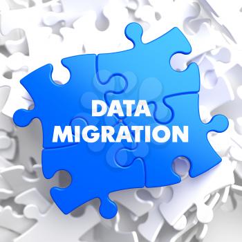 Data Migration on Blue Puzzle on White Background.
