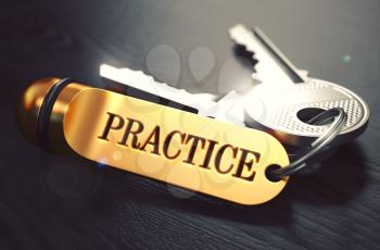 Practice - Bunch of Keys with Text on Golden Keychain. Black Wooden Background. Closeup View with Selective Focus. 3D Illustration. Toned Image.
