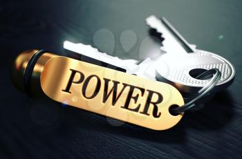Keys to Power - Concept on Golden Keychain over Black Wooden Background. Closeup View, Selective Focus, 3D Render. Toned Image.