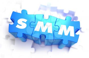 SMM - Social Media Marketing - Text on Blue Puzzles on White Background. 3D Render. 