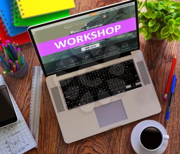 Workshop Concept. Modern Laptop and Different Office Supply on Wooden Desktop background.