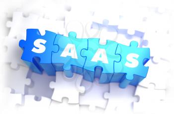 SaaS - Software as a Service - Text on Blue Puzzles on White Background. 3D Render. 