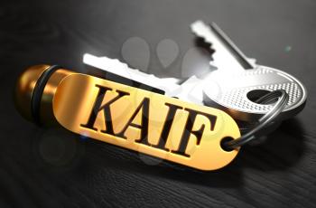 Keys with Word Kaif  on Golden Label over Black Wooden Background. Closeup View, Selective Focus, 3D Render.