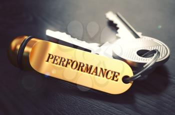 Performance Concept. Keys with Golden Keyring on Black Wooden Table. Closeup View, Selective Focus, 3D Render. Toned Image.