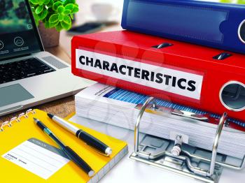 Characteristics - Red Ring Binder on Office Desktop with Office Supplies and Modern Laptop. Business Concept on Blurred Background. Toned Illustration.