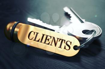 Keys to Clients - Concept on Golden Keychain over Black Wooden Background. Closeup View, Selective Focus, 3D Render. Toned Image.