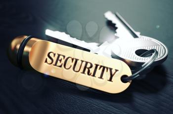 Security Concept. Keys with Golden Keyring on Black Wooden Table. Closeup View, Selective Focus, 3D Render. Toned Image.