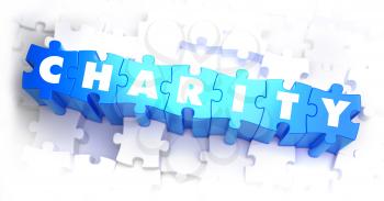 Charity -  Word on Blue Puzzles on White Background. 3D Render. 