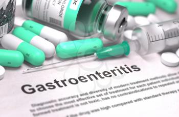 Gastroenteritis - Printed Diagnosis with Blurred Text. On Background of Medicaments Composition - Mint Green Pills, Injections and Syringe.