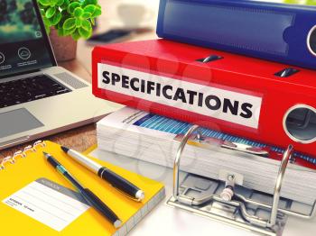 Specifications - Red Office Folder on Background of Working Table with Stationery, Laptop and Reports. Business Concept on Blurred Background. Toned Image.
