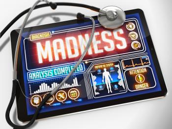 Madness - Diagnosis on the Display of Medical Tablet and a Black Stethoscope on White Background.