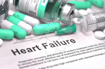Heart Failure - Printed Diagnosis with Mint Green Pills, Injections and Syringe. Medical Concept with Selective Focus.