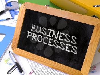 Hand Drawn Business Processes Concept  on Chalkboard. Blurred Background. Toned Image.