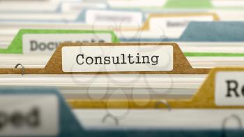File Folder Labeled as Consulting in Multicolor Archive. Closeup View. Blurred Image.