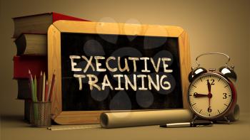 Executive Training Concept Hand Drawn on Chalkboard. Blurred Background. Toned Image.