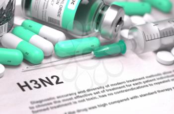 H3N2 - Printed Diagnosis with Mint Green Pills, Injections and Syringe. Medical Concept with Selective Focus.