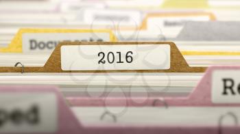 File Folder Labeled as 2016 in Multicolor Archive. Closeup View. Blurred Image.