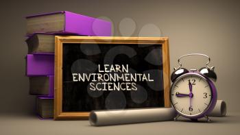Learn Environmental Sciences. Motivational Quote Hand Drawn on Chalkboard. Blurred Background. Toned Image.