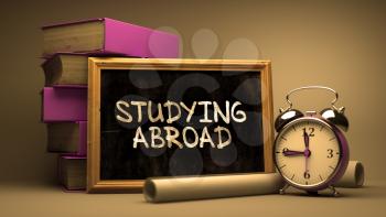 Hand Drawn Studying Abroad Concept on Chalkboard. Blurred Background. Toned Image.