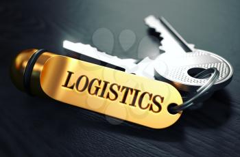 Logistics - Bunch of Keys with Text on Golden Keychain. Black Wooden Background. Closeup View with Selective Focus. 3D Illustration. Toned Image.