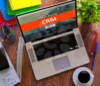 CRM - Customer Relationship Management - on Laptop Screen. Office Working Concept.