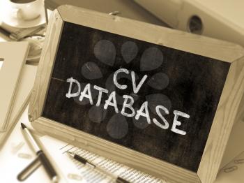 CV Database Concept Hand Drawn on Chalkboard on Working Table Background. Blurred Background. Toned Image.