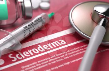 Scleroderma - Medical Concept on Red Background with Blurred Text and Composition of Pills, Syringe and Stethoscope.