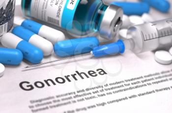 Gonorrhea - Printed Diagnosis with Blurred Text. On Background of Medicaments Composition - Blue Pills, Injections and Syringe.