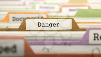 Danger - Folder Register Name in Directory. Colored, Blurred Image. Closeup View.