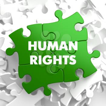 Human Rights on Green Puzzle on White Background.
