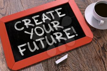 Create Your Future - Inspirational Quote Hand Drawn on Red Chalkboard on Wooden Table. Business Background. Top View.