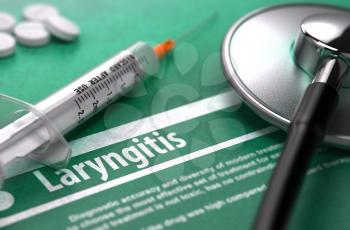 Laryngitis - Medical Concept with Blurred Text, Stethoscope, Pills and Syringe on Green Background. Selective Focus.