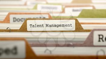 File Folder Labeled as Talent Management in Multicolor Archive. Closeup View. Blurred Image.
