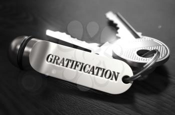 Gratification Concept. Keys with Keyring on Black Wooden Table. Closeup View, Selective Focus, 3D Render. Black and White Image.