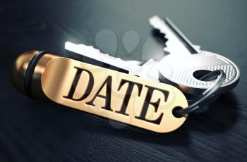 Keys with Word Date on Golden Label over Black Wooden Background. Closeup View, Selective Focus, 3D Render. Toned Image.