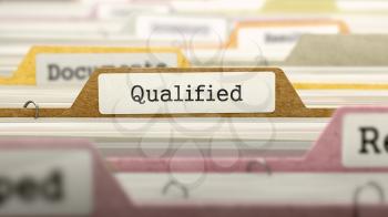 Qualified on Business Folder in Multicolor Card Index. Closeup View. Blurred Image.