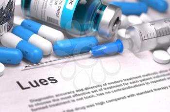 Lues - Printed Diagnosis with Blurred Text. On Background of Medicaments Composition - Blue Pills, Injections and Syringe.