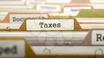 Taxes Concept on Folder Register in Multicolor Card Index. Closeup View. Selective Focus.